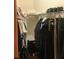 Organized closet space with clothing racks, overhead storage, and a wheelchair inside at 13111 Sunshine Cir, Clermont, FL 34711