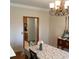 Traditional dining room with wood floors and chandelier at 13111 Sunshine Cir, Clermont, FL 34711