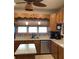 Bright kitchen featuring stainless appliances and modern lighting at 13111 Sunshine Cir, Clermont, FL 34711