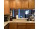 Spacious kitchen with countertops, tile backsplash, and wood cabinets at 13111 Sunshine Cir, Clermont, FL 34711