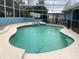 An inviting screened pool with attached jacuzzi at 13111 Sunshine Cir, Clermont, FL 34711