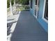 Spacious porch with wooden decking and white railings, perfect for outdoor relaxation at 13111 Sunshine Cir, Clermont, FL 34711