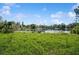 Backyard view of lake with dock at 1389 Gainesville Ln, Deltona, FL 32725