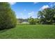 Serene backyard with a lake view and ample green space at 1389 Gainesville Ln, Deltona, FL 32725