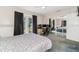 Comfortable bedroom featuring a computer workstation, plush carpet, and mirrored closet doors at 1389 Gainesville Ln, Deltona, FL 32725