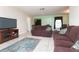The living room features an open floorplan with a view into the dining room at 1389 Gainesville Ln, Deltona, FL 32725