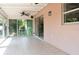 Bright sunroom with tile flooring, ceiling fan, and large sliding glass doors at 1389 Gainesville Ln, Deltona, FL 32725