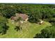 Beautiful home with a spacious yard, surrounded by mature trees, offering a serene retreat at 1391 Terry Ln, Kissimmee, FL 34744