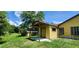 Yard view of backyard and utility building; partially fenced and offers plenty of green space at 1391 Terry Ln, Kissimmee, FL 34744