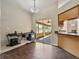 Cozy dining area featuring tiled floors, natural light, and easy access to the outdoor screened porch at 1391 Terry Ln, Kissimmee, FL 34744