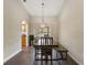 Elegant dining room featuring a modern light fixture, hardwood floors, and plenty of space for Gathering gatherings at 1391 Terry Ln, Kissimmee, FL 34744