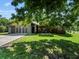 Charming single-Gathering home featuring well-maintained landscaping, a two-car garage, and brick accents at 1391 Terry Ln, Kissimmee, FL 34744