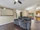 Comfortable living room showcasing a plush sofa, tiled floors, and an open layout, perfect for relaxation at 1391 Terry Ln, Kissimmee, FL 34744
