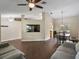 Open-concept living room seamlessly connects to the dining area, offering a comfortable and spacious layout at 1391 Terry Ln, Kissimmee, FL 34744