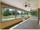 Screened-in patio overlooking a spacious green backyard at 1391 Terry Ln, Kissimmee, FL 34744