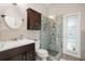 Bright bathroom featuring a glass shower, mosaic tile accents, and stylish vanity with ample storage at 14131 Islamorada Dr, Orlando, FL 32837