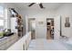 Bedroom with open doorway and a shelf with decorations, plus a ceiling fan at 14131 Islamorada Dr, Orlando, FL 32837