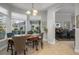 Bright breakfast nook with large windows overlooking the outdoor living space and pool at 14131 Islamorada Dr, Orlando, FL 32837
