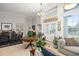 Wide view of foyer with tile floors, high ceilings, dining table, and open living area at 14131 Islamorada Dr, Orlando, FL 32837