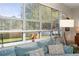 Bright room with a view of the lake, featuring comfortable seating and a relaxing atmosphere by the window at 14131 Islamorada Dr, Orlando, FL 32837
