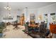 Open floor plan showing the living room with elegant decor flowing into the dining area at 14131 Islamorada Dr, Orlando, FL 32837