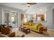 Open-concept living area leads to kitchen and outdoor patio at 14131 Islamorada Dr, Orlando, FL 32837