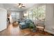 Inviting living room with a plush sectional sofa, wood floors, and a large window with scenic views at 14131 Islamorada Dr, Orlando, FL 32837