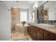 The main bathroom features a standalone tub, tiled shower, and double sink vanity at 14131 Islamorada Dr, Orlando, FL 32837