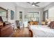 Sunlit main bedroom showcasing the wooden floors, natural light, and tasteful decor at 14131 Islamorada Dr, Orlando, FL 32837