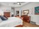 The main bedroom features an ensuite bathroom, wooden floors, and abundant natural light at 14131 Islamorada Dr, Orlando, FL 32837