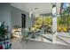Outdoor screened-in lanai with plenty of seating space and a view of the backyard pond at 14131 Islamorada Dr, Orlando, FL 32837