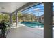 Inviting screened-in pool with lush greenery view, perfect for relaxation and outdoor enjoyment at 14131 Islamorada Dr, Orlando, FL 32837