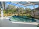 Beautiful screened-in lanai with a pool and a pond at 14131 Islamorada Dr, Orlando, FL 32837