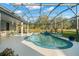 A great view of the pool and the nice seating area in the screened-in lanai at 14131 Islamorada Dr, Orlando, FL 32837