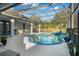 Beautiful view of the pool area with lounge chairs and a tranquil view of the pond at 14131 Islamorada Dr, Orlando, FL 32837
