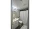 Bathroom showcasing a vanity, mirror and white shower curtain at 151 N Orlando Ave # 118, Winter Park, FL 32789