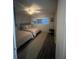Bedroom showcasing two beds, neutral decor, a ceiling fan and natural light at 151 N Orlando Ave # 118, Winter Park, FL 32789