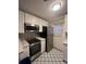 Cozy kitchen featuring stainless steel appliances and blue patterned flooring at 151 N Orlando Ave # 118, Winter Park, FL 32789