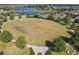Expansive community green space with lake, tennis courts, and pool at 16391 Admirals Cove Ln, Winter Garden, FL 34787