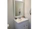 Bathroom featuring a white vanity with a framed mirror and soft decor, perfect for relaxation at 16391 Admirals Cove Ln, Winter Garden, FL 34787
