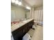 Spacious bathroom with double sinks, vanity with granite countertop, and stylish fixtures plus a shower at 16391 Admirals Cove Ln, Winter Garden, FL 34787