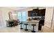 Modern kitchen features a breakfast bar with granite countertops, stainless steel appliances, and dark cabinetry with lots of natural light at 16391 Admirals Cove Ln, Winter Garden, FL 34787
