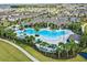 Aerial view of resort-style pool with lush landscaping, multiple seating areas, and Gathering-friendly amenities at 16391 Admirals Cove Ln, Winter Garden, FL 34787