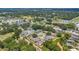 Scenic aerial view of a residential community with lush greenery and convenient access to nearby amenities at 1642 Windsor Oak Ct, Kissimmee, FL 34744