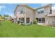 Spacious backyard with lush green grass at 1642 Windsor Oak Ct, Kissimmee, FL 34744