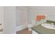 Bathroom with shower over bath, toilet, sink and orange towels at 1642 Windsor Oak Ct, Kissimmee, FL 34744