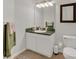 Cozy bathroom offering a mirror, vanity, and toilet at 1642 Windsor Oak Ct, Kissimmee, FL 34744