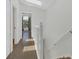 Upstairs hallway with natural light and access to multiple rooms and a view into another room at 1642 Windsor Oak Ct, Kissimmee, FL 34744