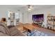 Open-concept living space with modern furnishings and access to the kitchen, perfect for entertaining guests at 1642 Windsor Oak Ct, Kissimmee, FL 34744