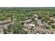Aerial view of community with lush greenery, well-maintained buildings, and community pool at 184 Sandlewood Trl # 2, Winter Park, FL 32789
